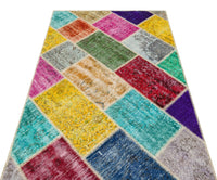 Bunter handgewebter Wollteppich mit geometrischem Muster 122x181 cm