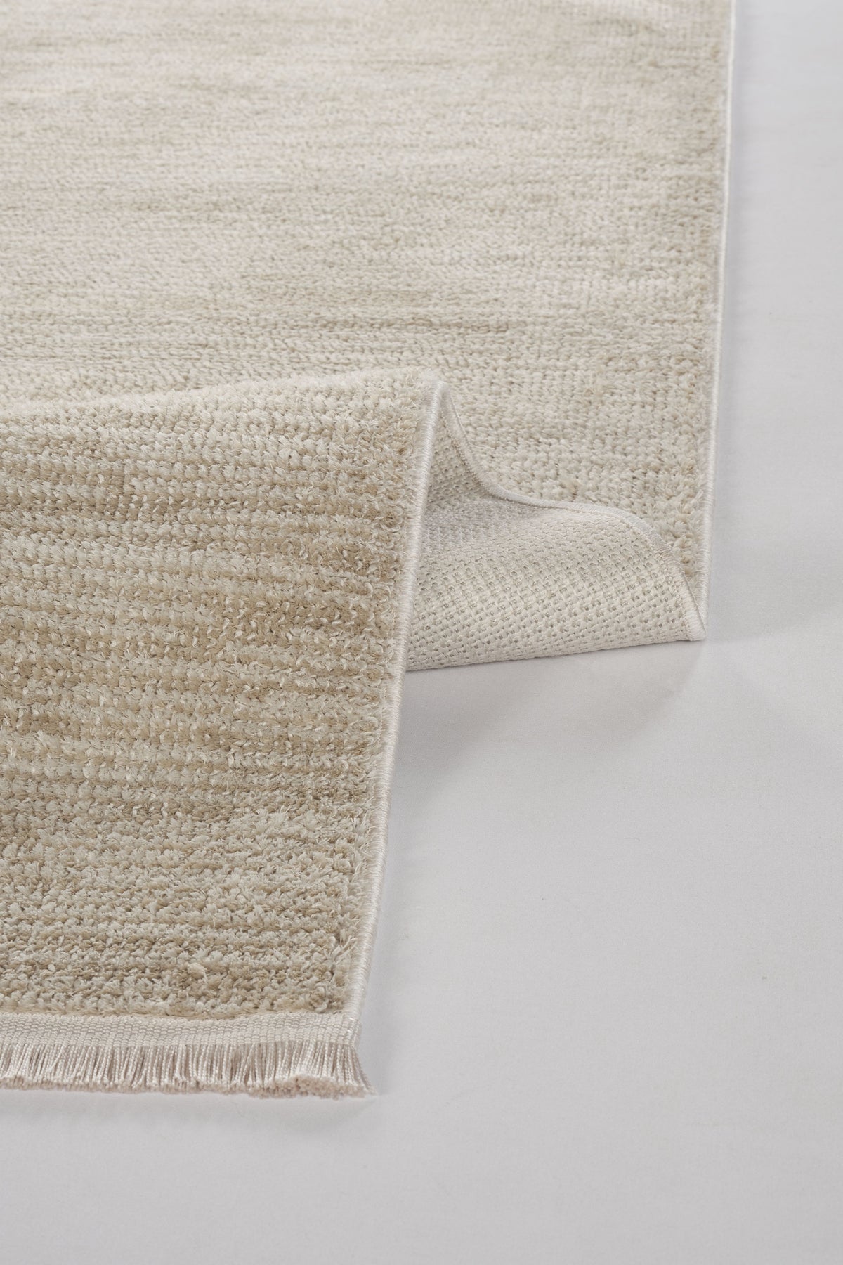 Alovi Bej Düz Desenli Modern Makine Halısı – doku yakın çekim