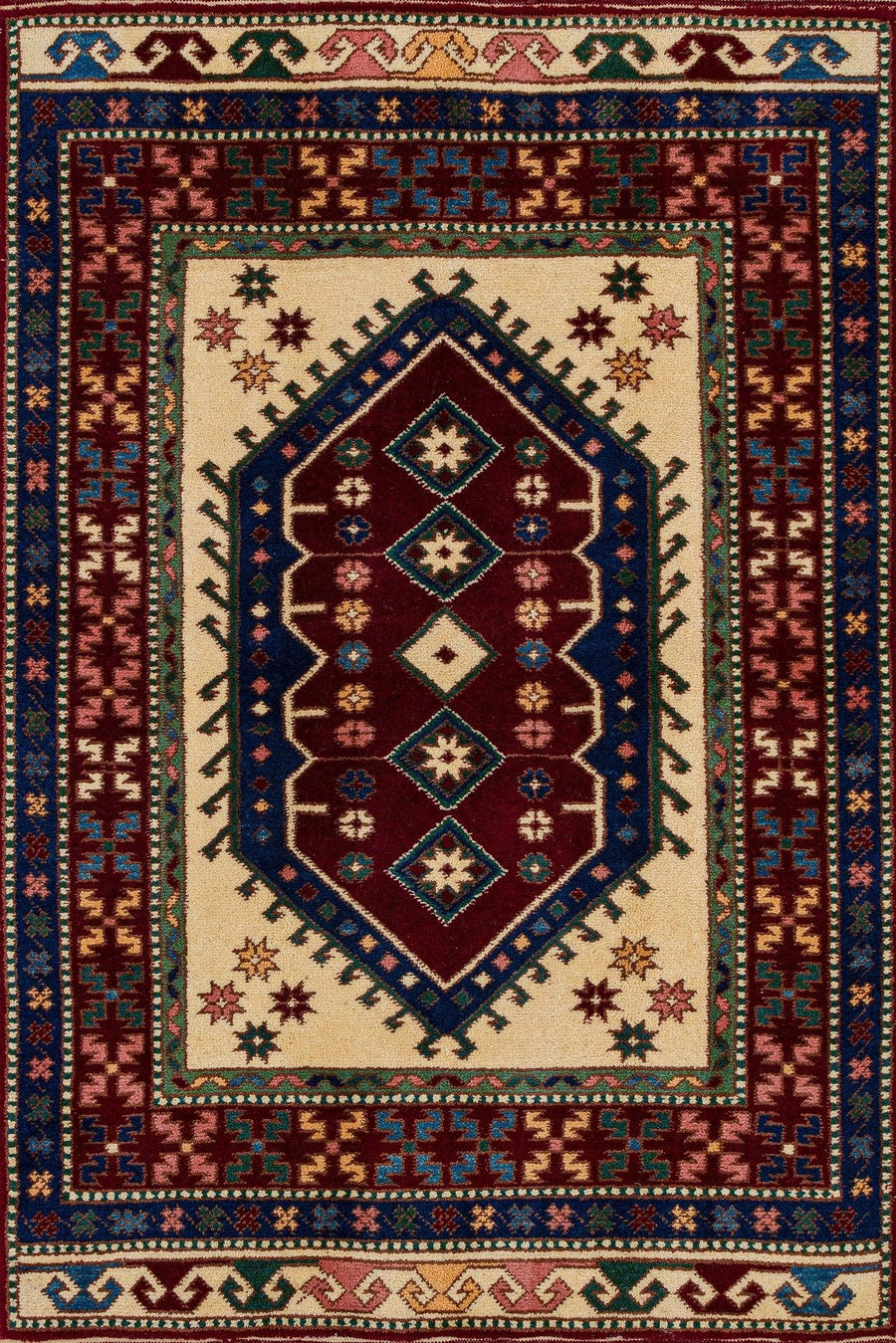 Cream and Burgundy Geometric Area Rug – in the living room