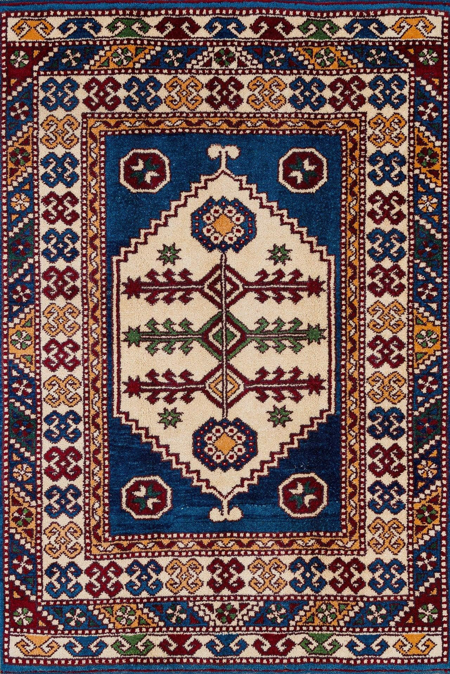Blue and Cream Geometric Pattern Area Rug – in the living room