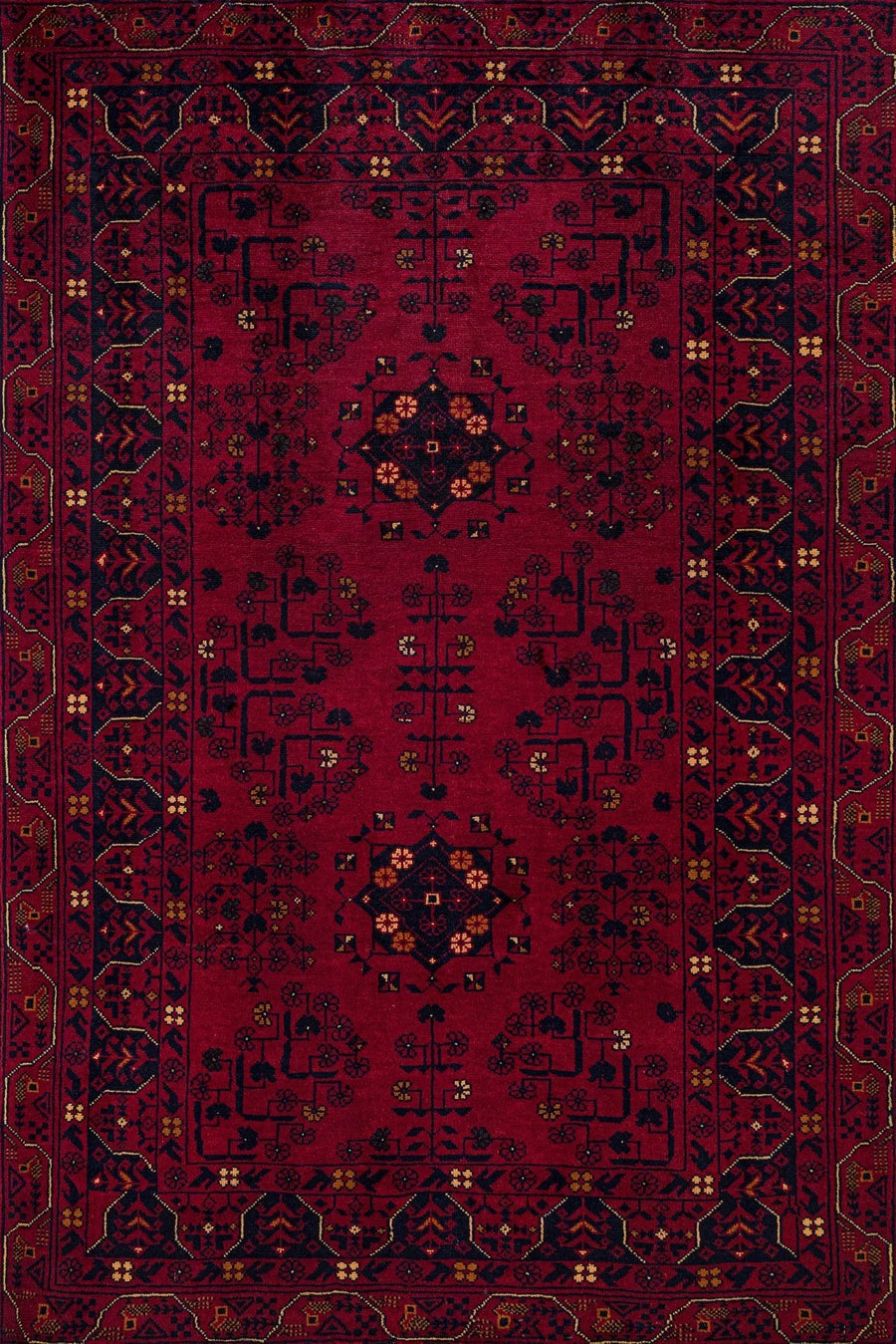 Burgundy and Navy Blue Medallion Area Rug – in the living room