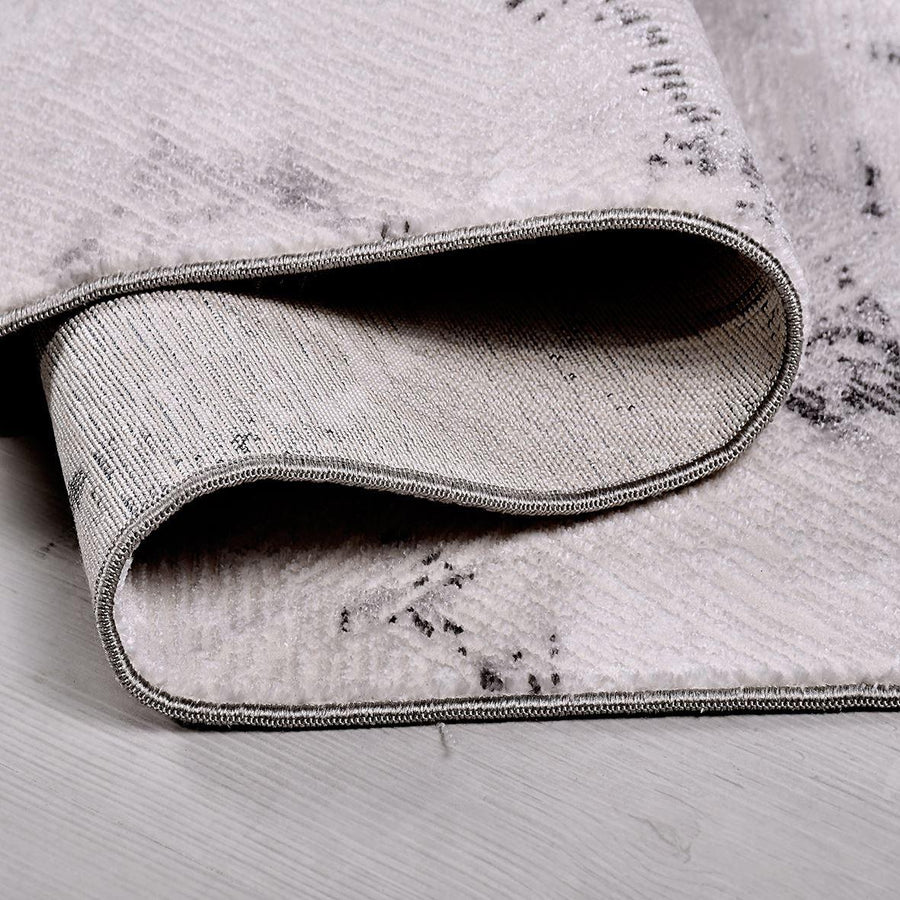 Modern Grey Textured Area Rug with Abstract Design – in the living room