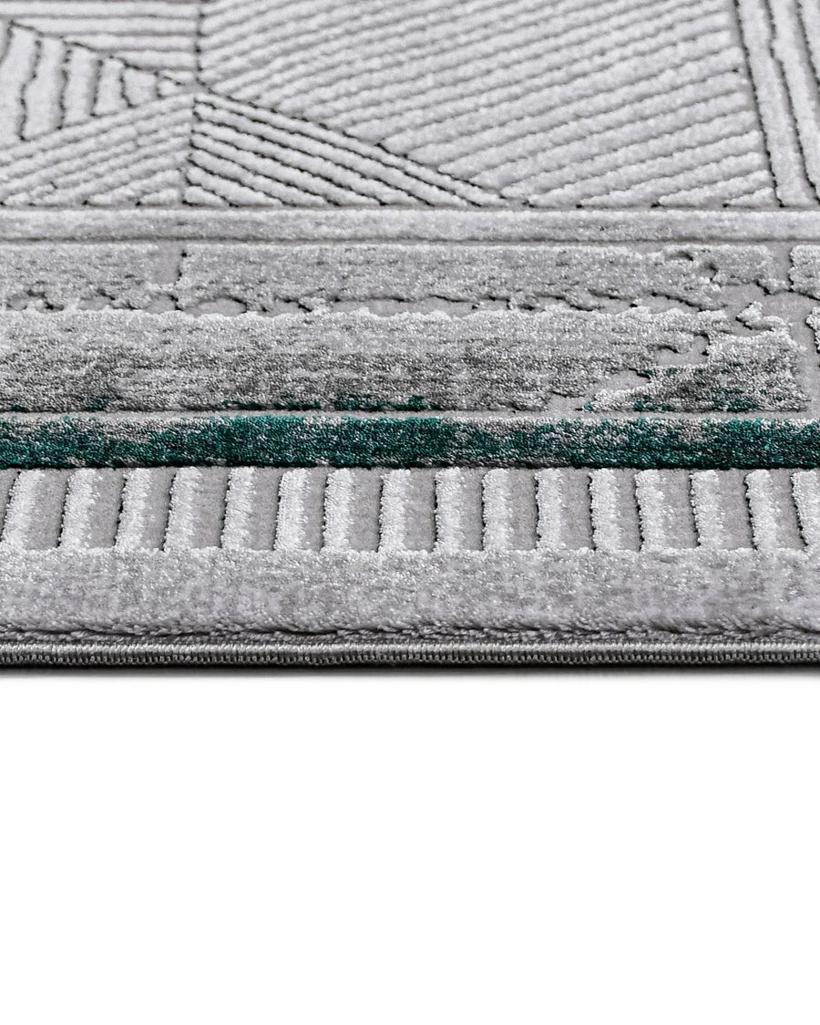 Grey and Turquoise Geometric Area Rug – in the living room