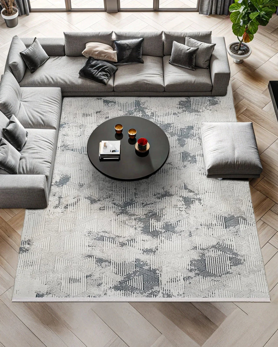 White and Grey Geometric Area Rug – in the living room