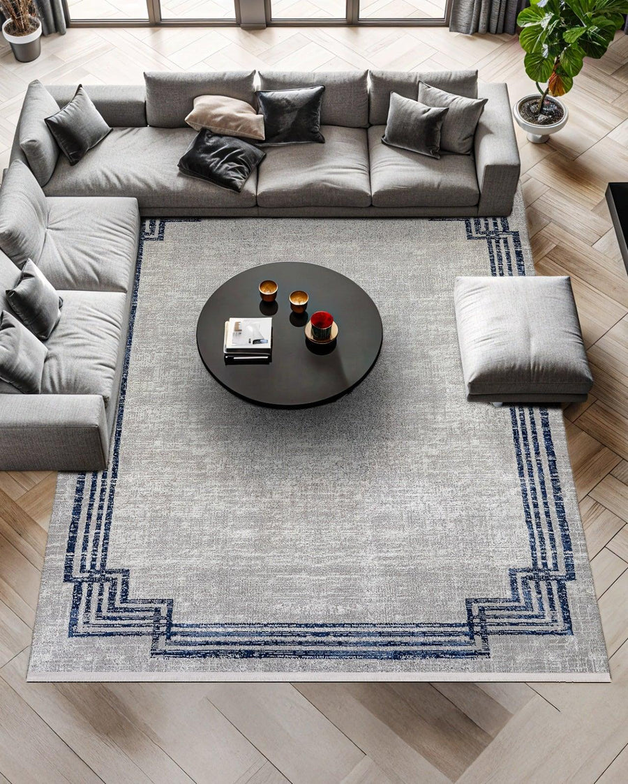 Grey and Navy Blue Distressed Geometric Rug – in the living room