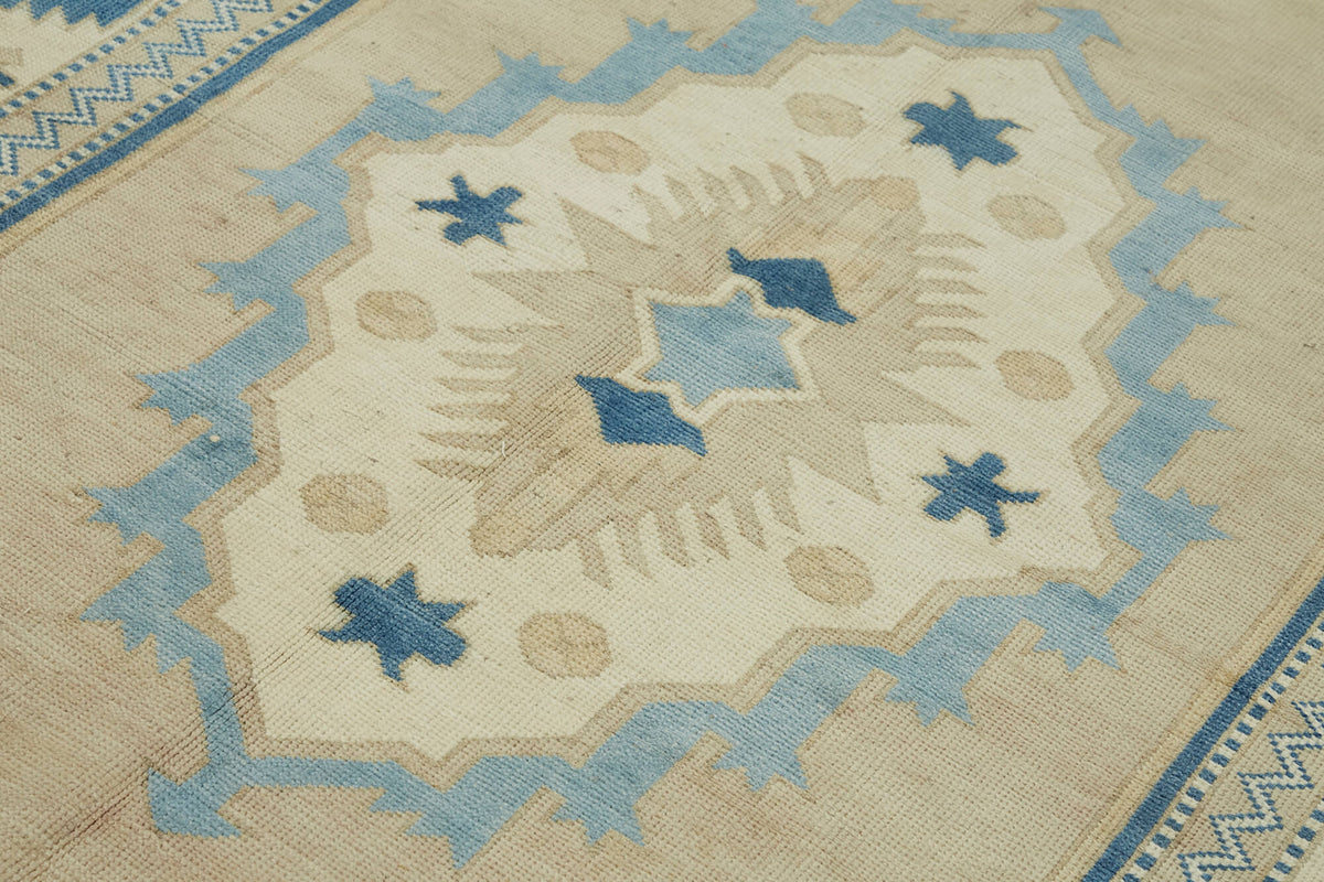 Kavale Bej Mavi Madalyon Desenli Geometrik El Dokuma Halı 169x257 cm – mekânda kullanım