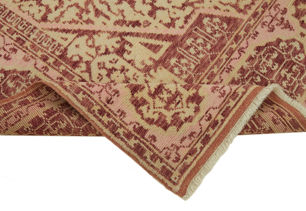Kavima Pembe Bej Madalyon Göbek Desenli Yün El Dokuma Halı 164x216 cm – kenar detayı
