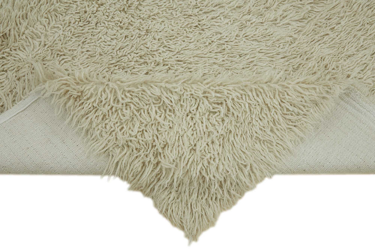 Timvi Desensiz Düz Bej ve Yeşil Renkli Tulu Halı 130x200 cm – kenar detayı