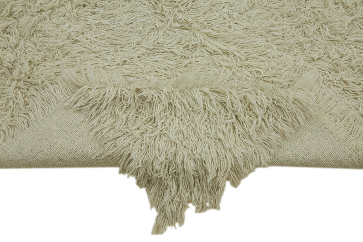 Timvi Düz Yeşil Halı Bej Rengi Shaggy Dokuma 153x235 cm – kenar detayı