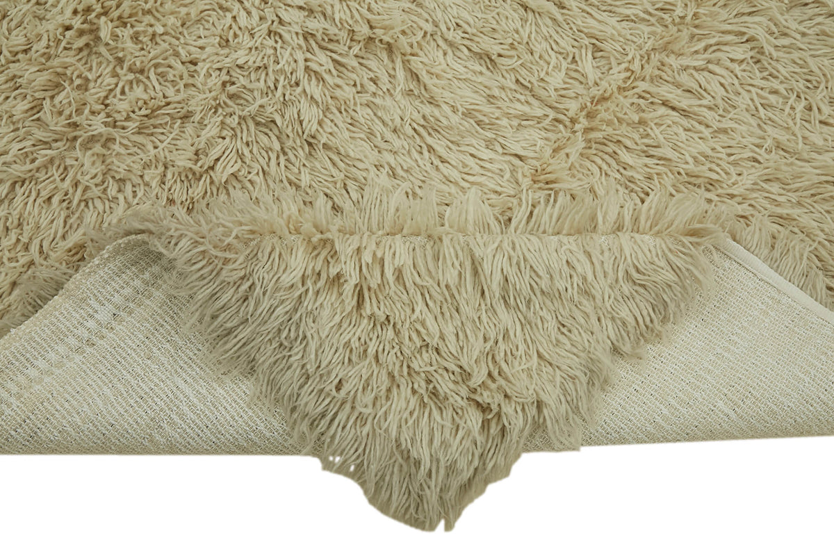Timvi Bej Yeşil Düz Modern Shaggy El Dokuma Halı 140x230 cm – kenar detayı