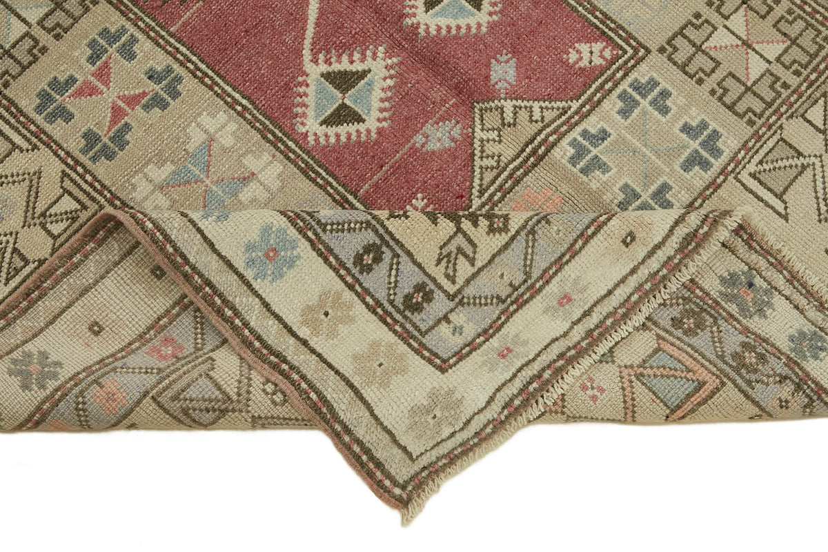 Gekro Bej Kırmızı Geometrik Desenli Yün El Dokuma Halı 123x229 cm – kenar detayı