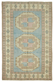Kavale Madalyon Desenli Mavi ve Toz Pembe El Dokuma Halı 148x228 cm