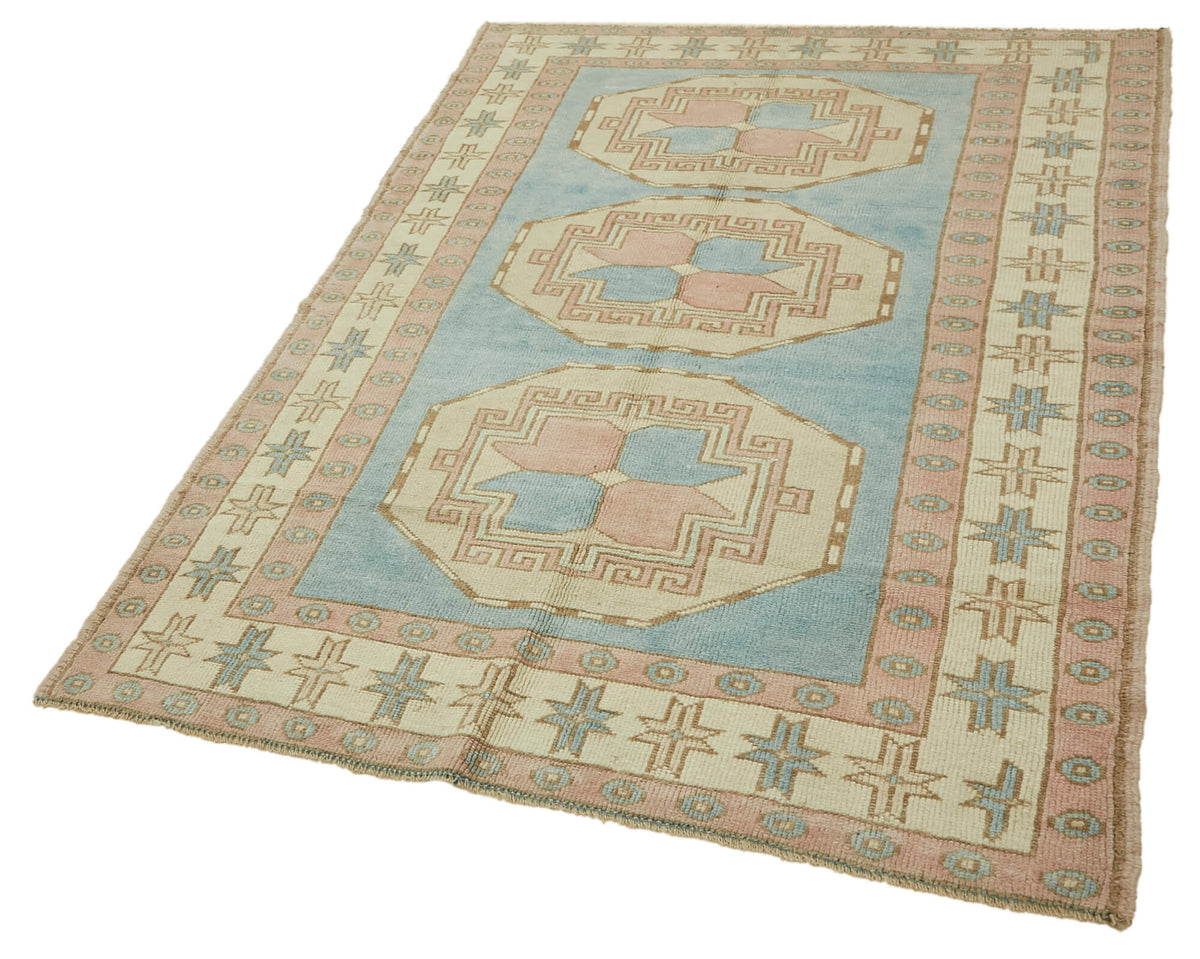 Kavale Madalyon Desenli Mavi ve Toz Pembe El Dokuma Halı 148x228 cm – doku yakın çekim