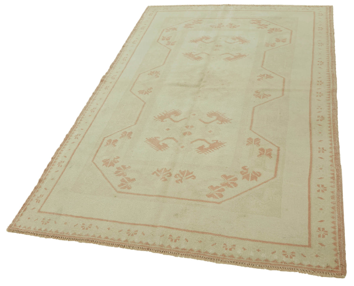 Gekro Dokuma Modern Halı Bej ve Toz Pembe Geometrik Desenli 135x211 cm – doku yakın çekim