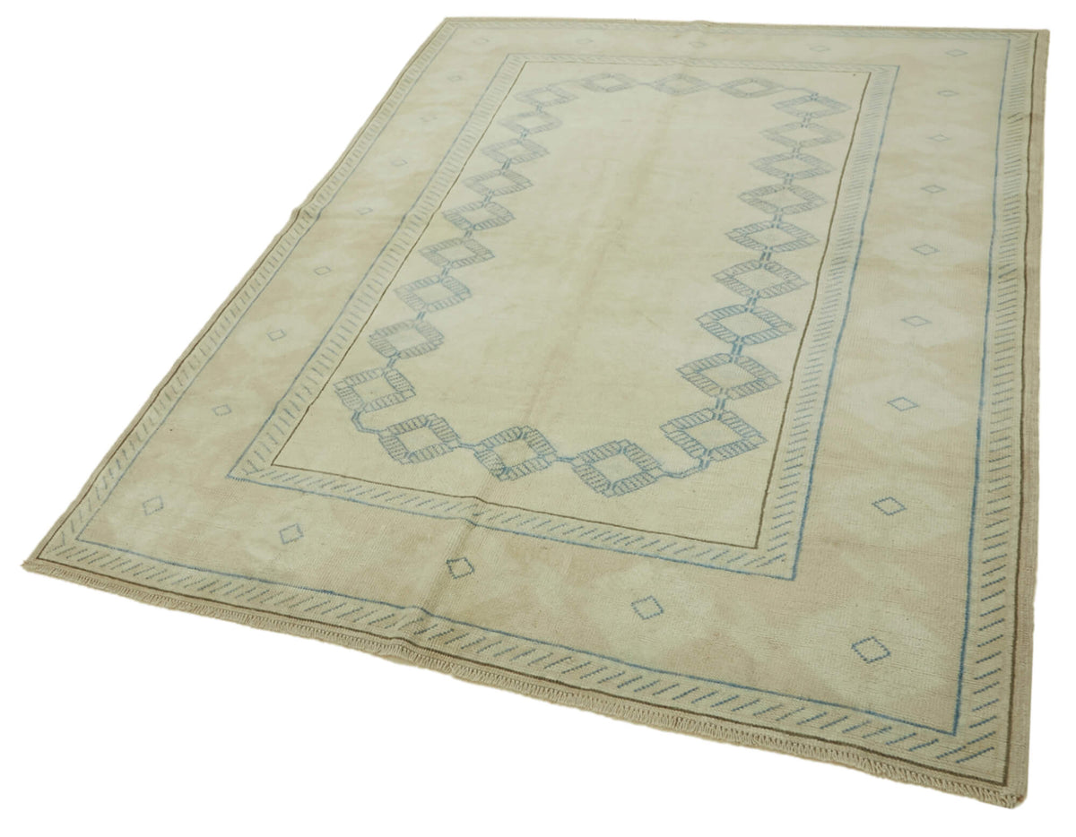 Kavale Bej Mavi Halı Geometrik Bordürlü ve Mat Dokulu 185x248 cm 46804 – doku yakın çekim