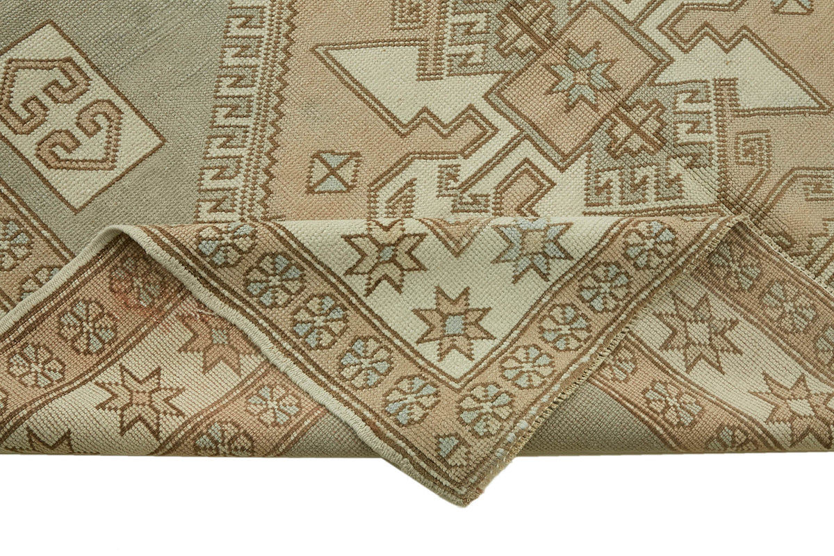 Kavale Bej Gri Geometrik Madalyon Desenli El Dokuma Halı 179x283 cm – kenar detayı