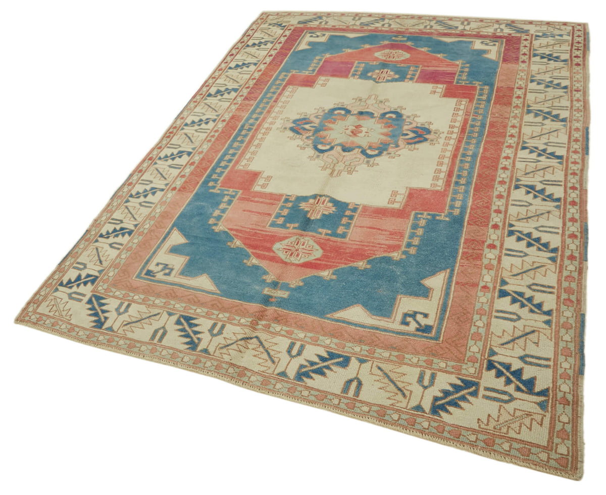 Kavale Krem Mavi Madalyon Göbek Desenli El Dokuma Halı 178x271 cm – doku yakın çekim