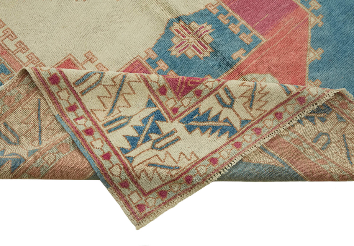 Kavale Krem Mavi Madalyon Göbek Desenli El Dokuma Halı 178x271 cm – kenar detayı