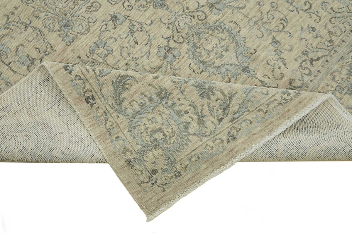 Veltos Açık Bej ve Buz Mavisi Madalyon Desenli Yün Halı 195x300 cm – kenar detayı