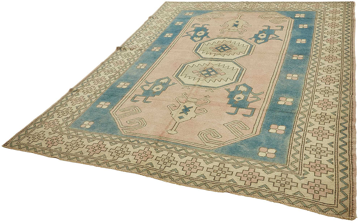 Kavale Toz Pembe Madalyon Desenli Yün Halı 184x255 cm – doku yakın çekim