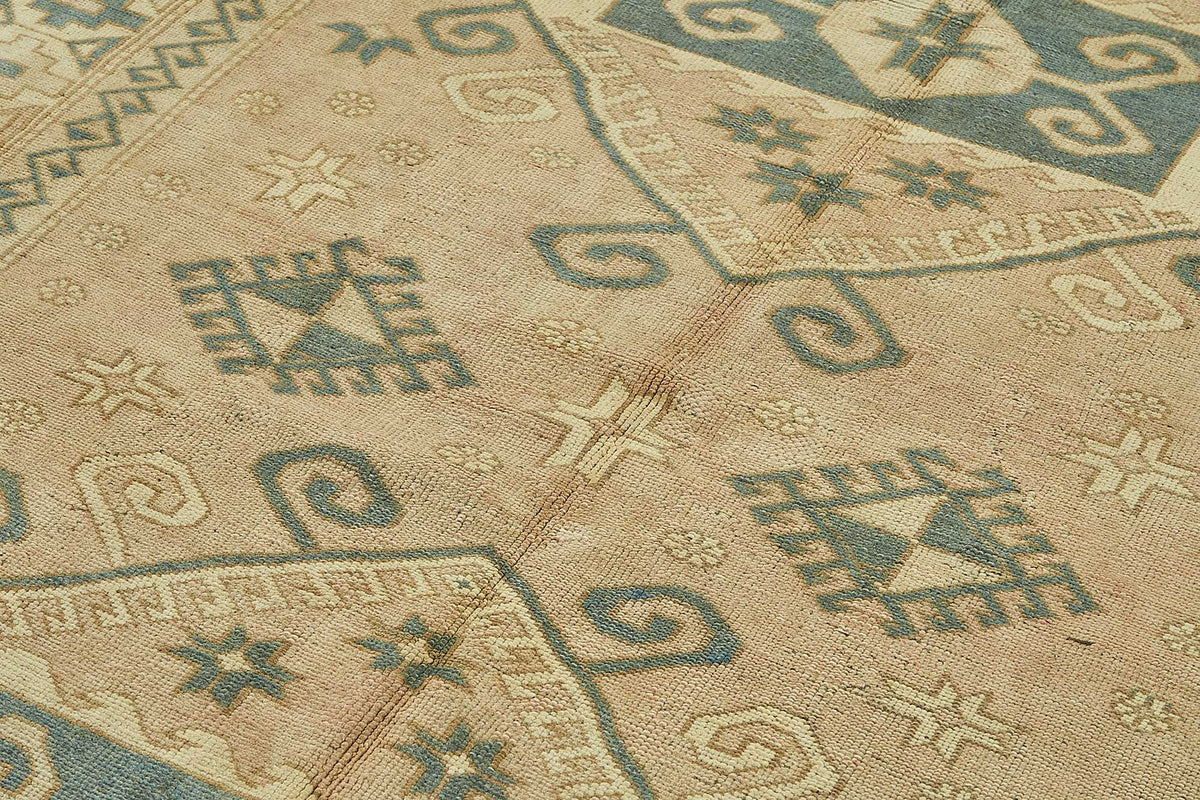 Kavale Madalyon Desenli Bej, Mavi ve Kiremit Renkli El Dokuma Halı 172x254 cm – mekânda kullanım