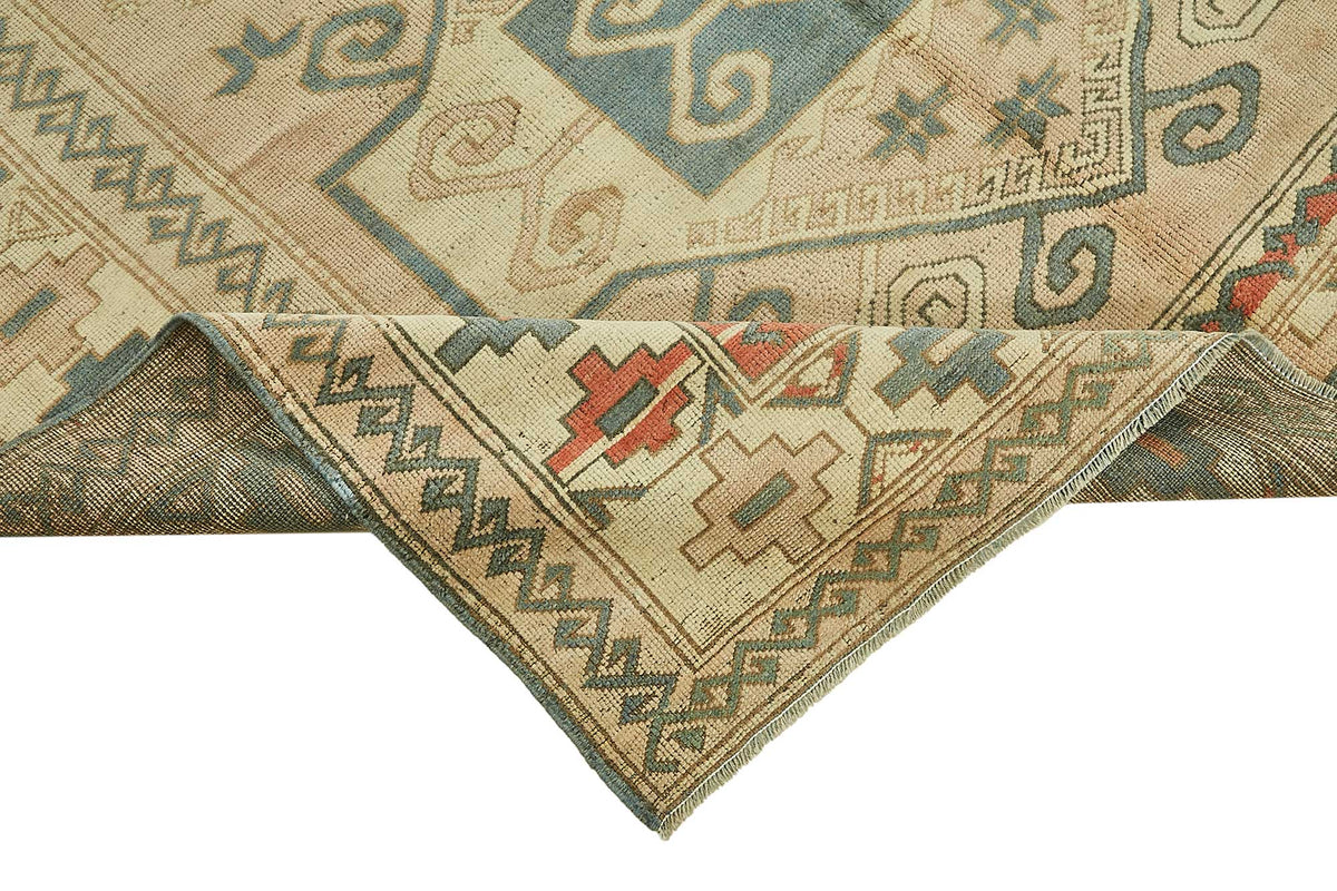 Kavale Madalyon Desenli Bej, Mavi ve Kiremit Renkli El Dokuma Halı 172x254 cm – kenar detayı