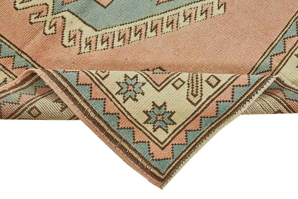 Gekro Pembe ve Mavi Geometrik Desenli Yün El Dokuma Halı 121x191 cm – kenar detayı