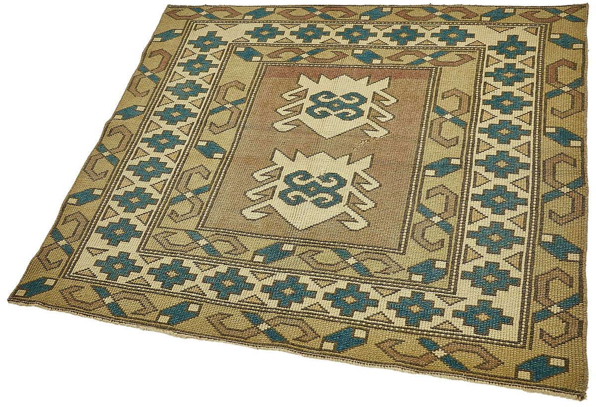 Gekro Bej Mavi Bordürlü Geometrik El Dokuma Halı 105x110 cm – doku yakın çekim