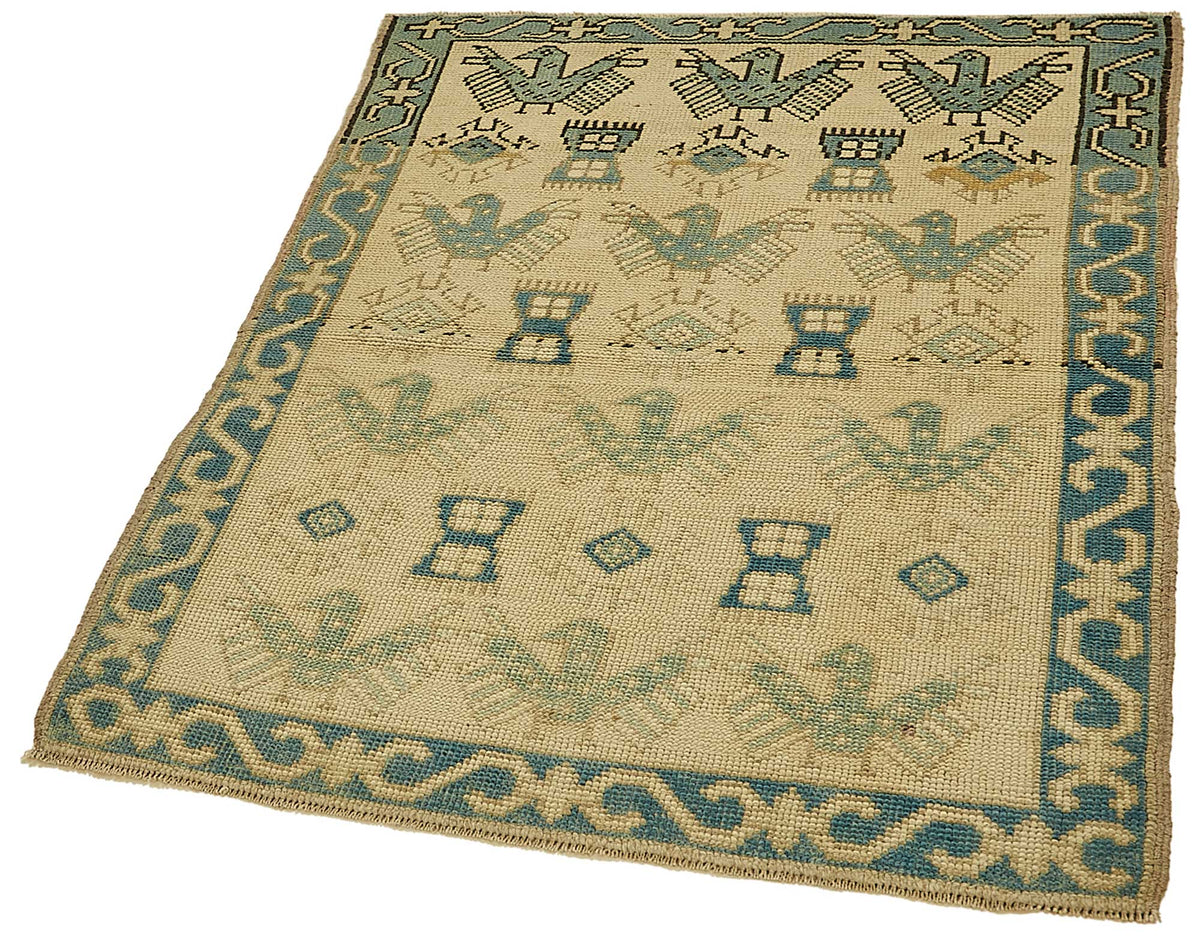 Gekro Geometrik Desenli Bej ve Mavi El Dokuma Halı 91x115 cm – doku yakın çekim