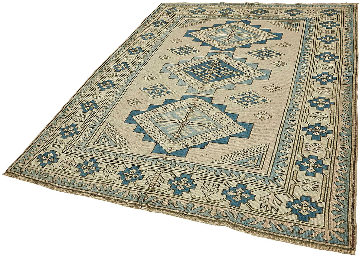 Kavale Madalyon Desenli Bej Mavi Vintage El Dokuma Halı 174x220 cm – doku yakın çekim