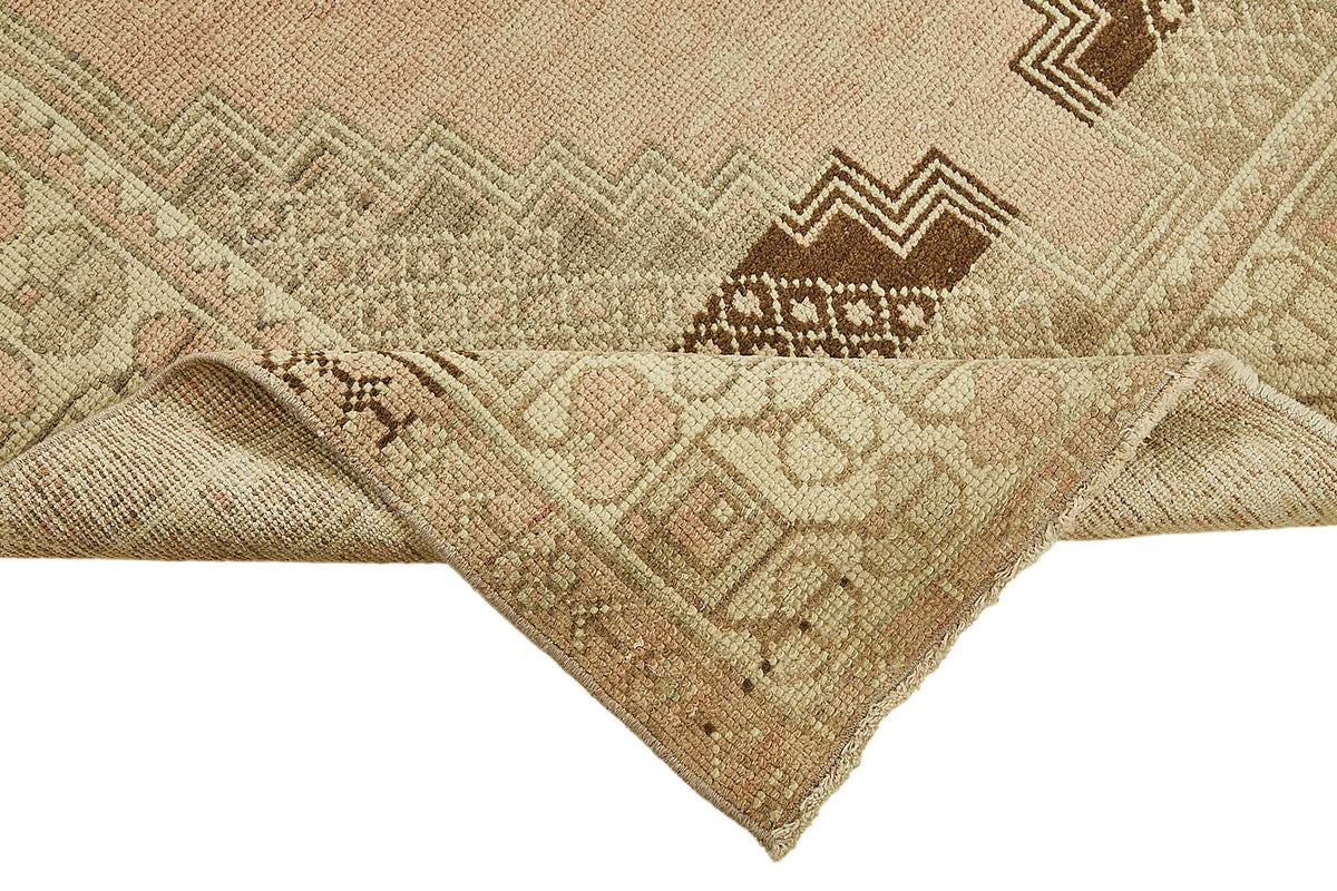 Gekro Bej ve Pembe Etnik Geometrik Desenli Yün Halı 121x250 cm – kenar detayı