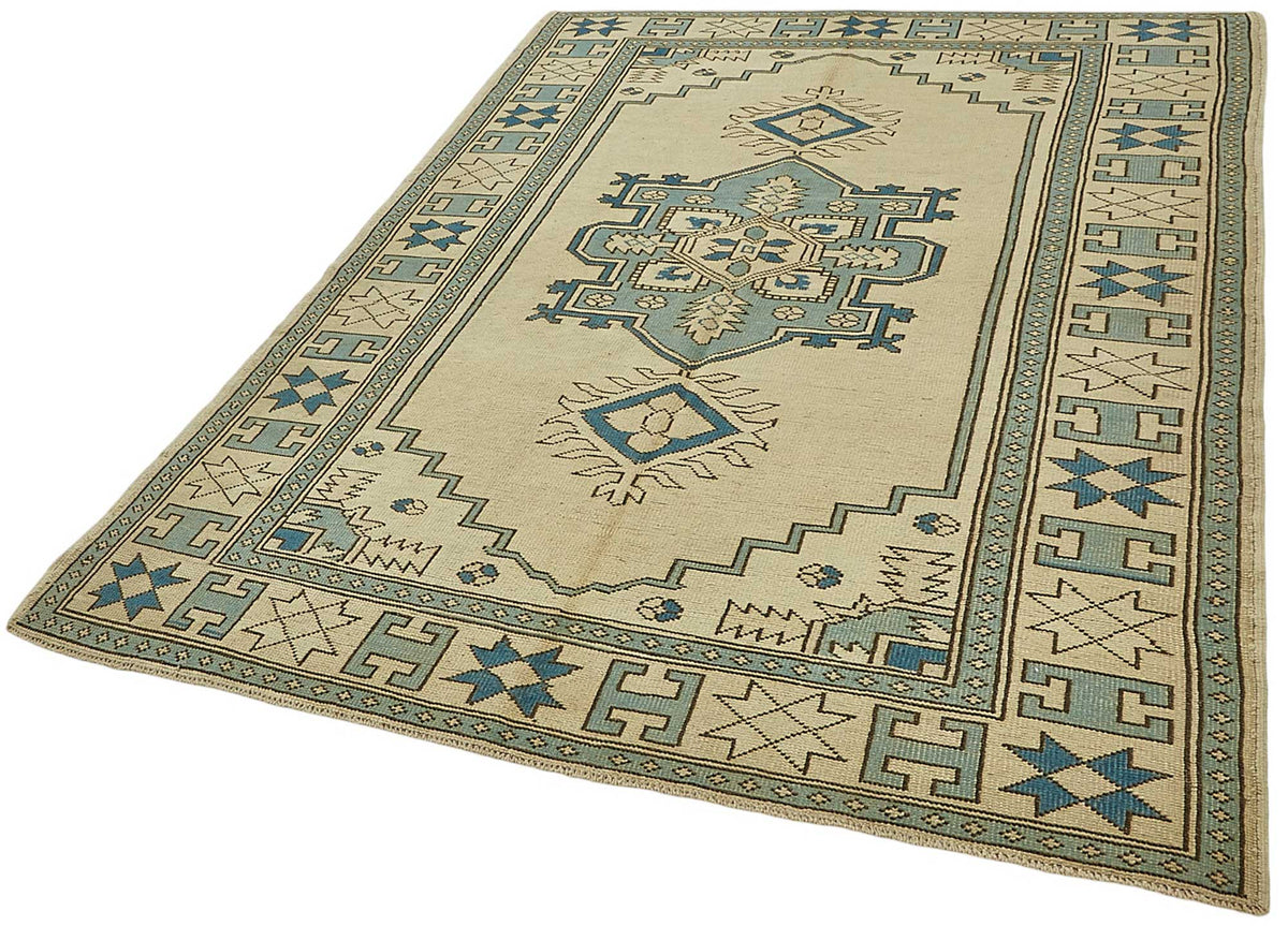 Kavale Bej ve Mavi Madalyon Desenli Yün Vintage Halı 172x235 cm – doku yakın çekim