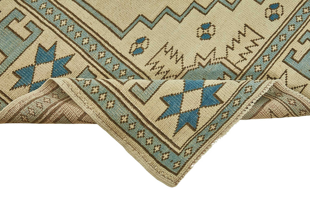Kavale Bej ve Mavi Madalyon Desenli Yün Vintage Halı 172x235 cm – kenar detayı