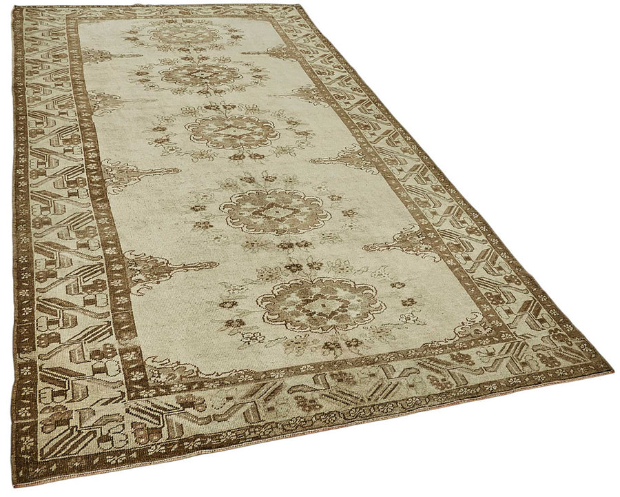 Alfombra Kavale marrón vintage con diseño de medallones, tejida 161x295 cm – vista general