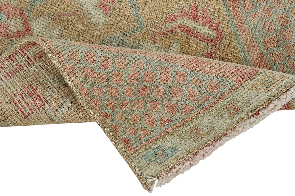 Vayla Açık Bej Soluk Pembe Madalyon El Dokuma Halı 40x75 cm – kenar detayı