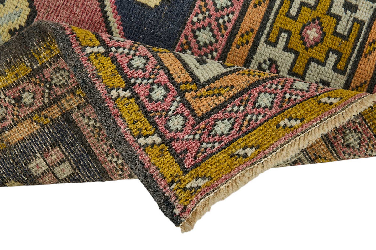 Vayla Lacivert Pembe Madalyon Desenli El Dokuma Halı 54x100 cm – kenar detayı