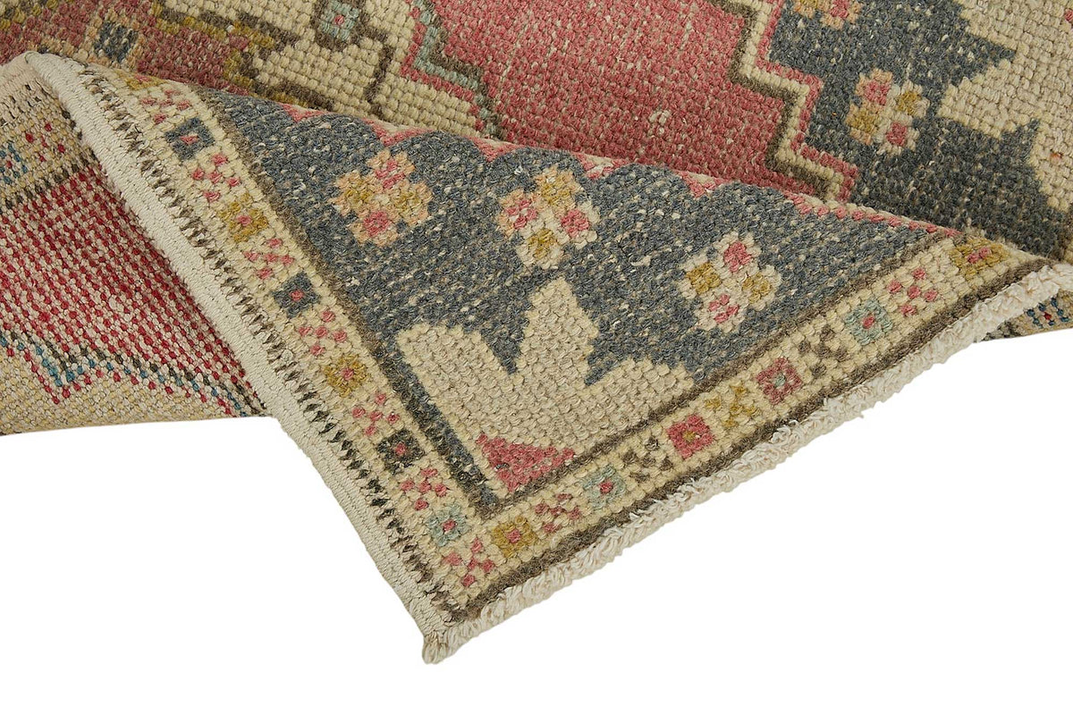 Vayla Pembe Lacivert Etnik Geometrik Desenli El Dokuma Halı 53x99 cm – kenar detayı