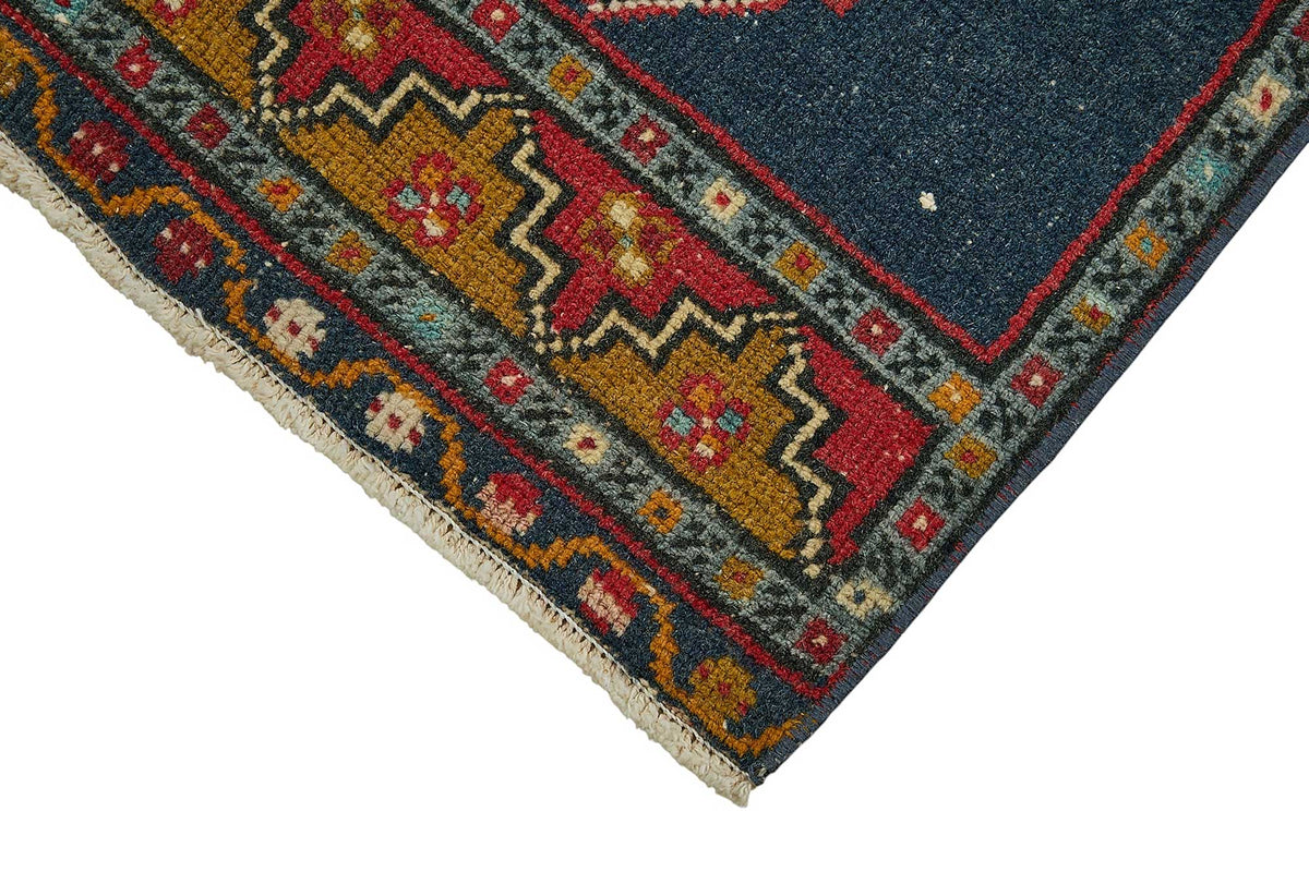Vayla Lacivert Kırmızı Madalyon Geometrik El Dokuma Halı 41x102 cm – detay görünümü