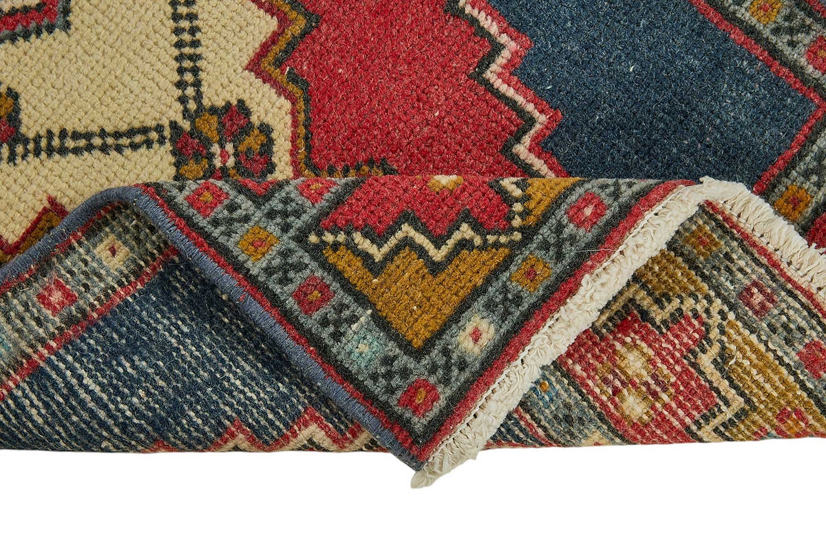 Vayla Lacivert Kırmızı Madalyon Geometrik El Dokuma Halı 41x102 cm – kenar detayı