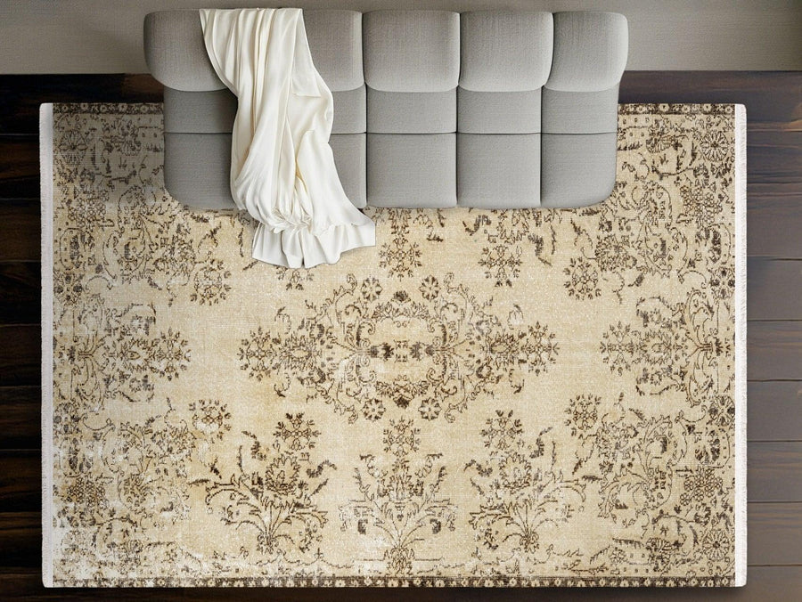 Beige Floral Distressed Area Rug with Brown Tones – in the living room