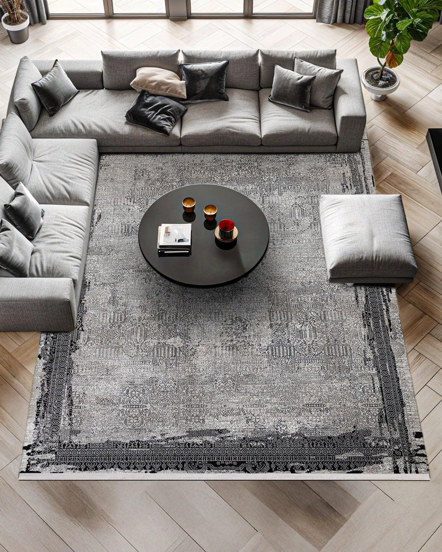 Grey and Black Abstract Distressed Area Rug – in the living room