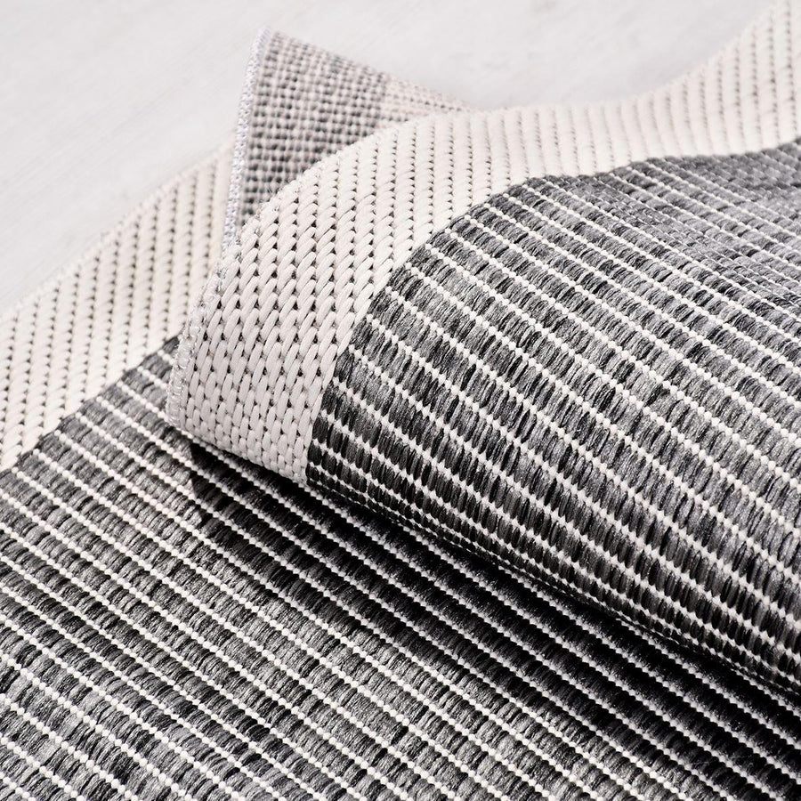 Grey Geometric Machine Washable Area Rug – in the hallway