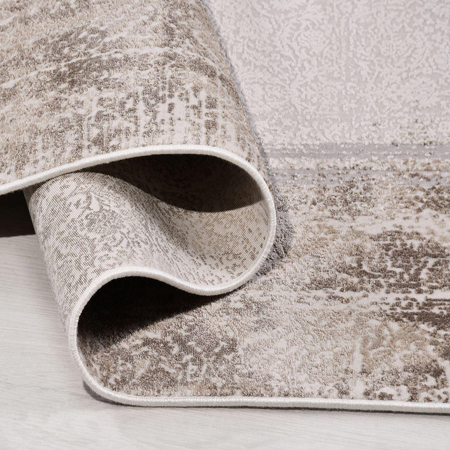 Beige Abstract Area Rug with Brown Accents – in the living room