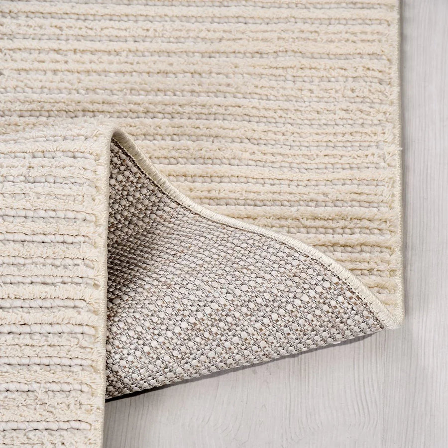 Modern Cream and White Striped Area Rug – in the living room