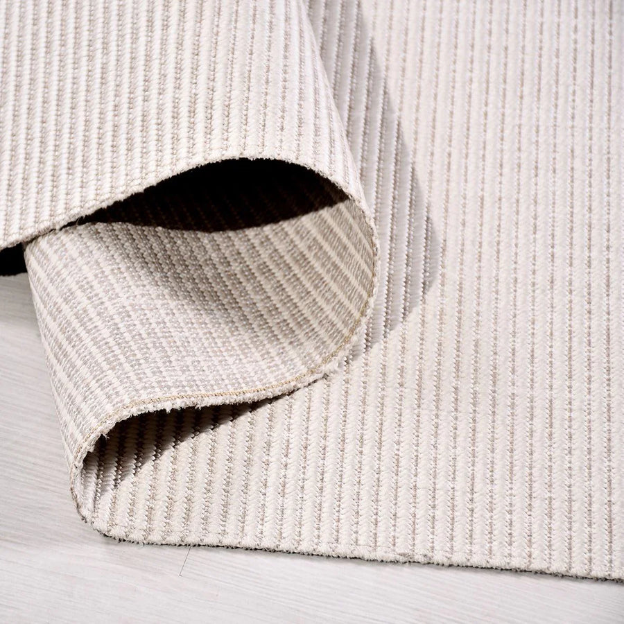 Modern Plain Beige Area Rug with Grooved Texture – in the living room