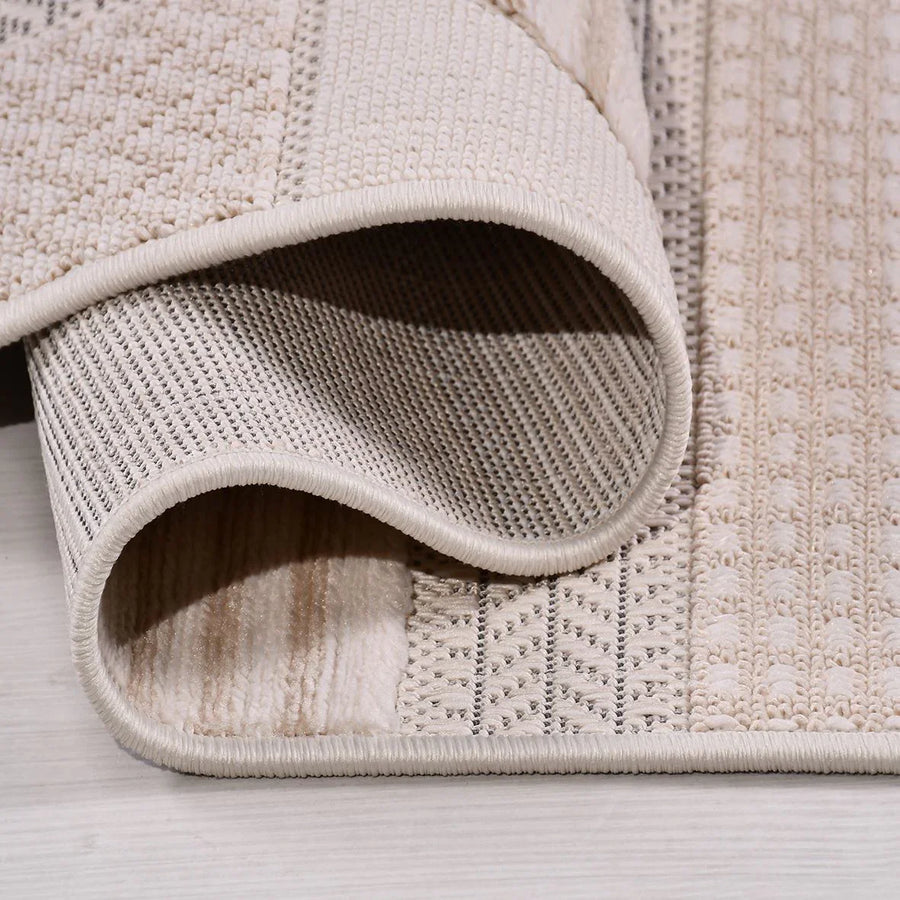 Beige Geometric Area Rug with Textured Weave – in the living room