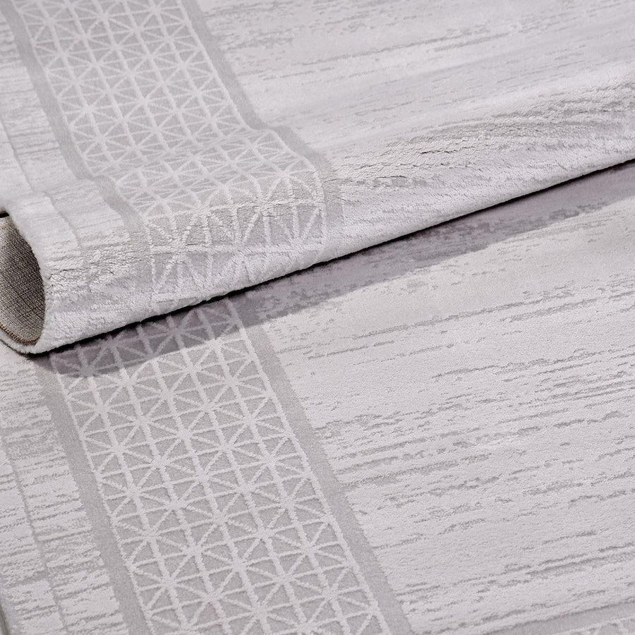 Grey Geometric Area Rug with Distressed Style – in the living room