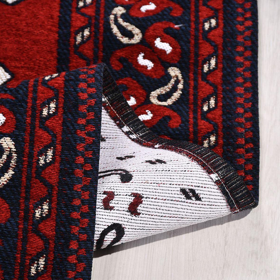 Red and Navy Blue Geometric Ethnic Area Rug – in the living room
