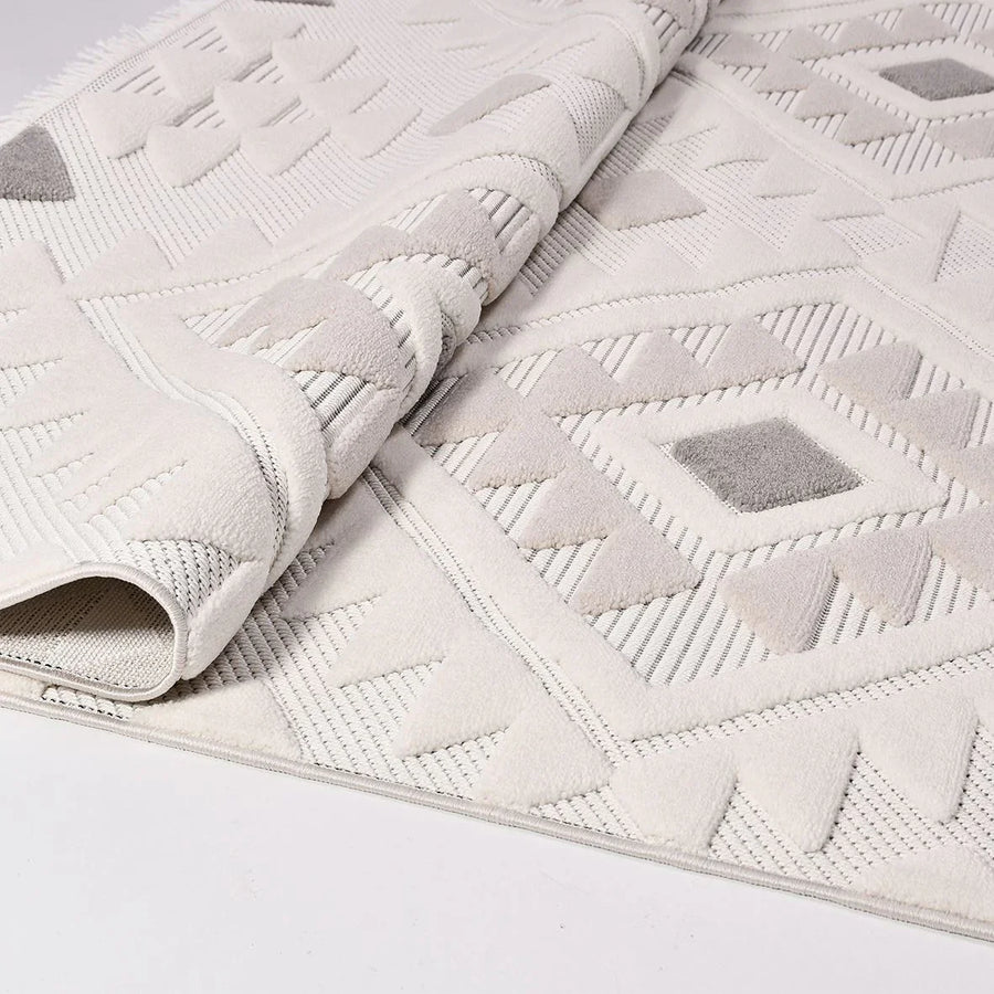 Cream and Grey Geometric Area Rug with 3D Texture – in the living room
