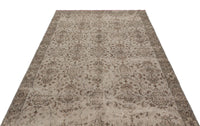 Alfombra beige de lana tejida a mano con motivos florales y acabado envejecido, 170x295 cm